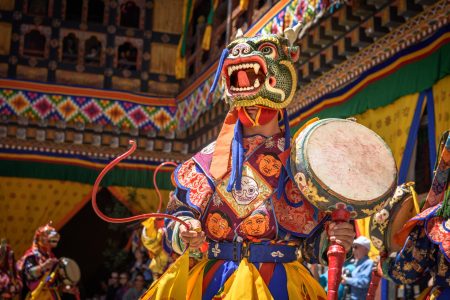 bhutan-monk-dancing-for-colorful-mask-dance-at-yearly-paro-tsechu-festival-in-bhutan